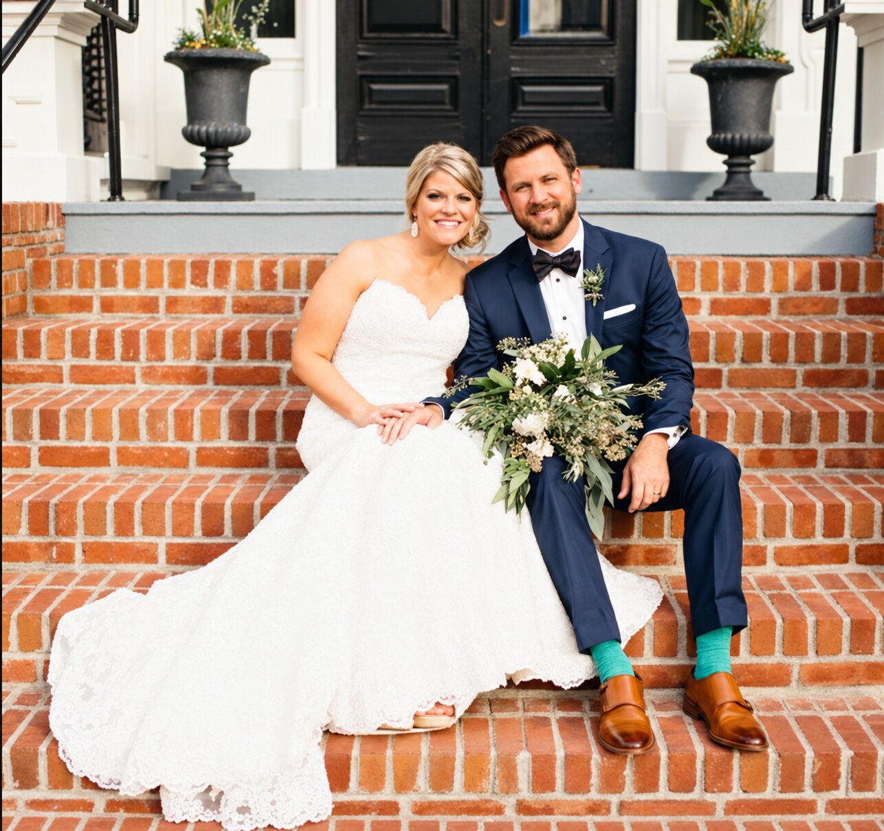 Bryan and Mandy sitting on brick steps on their wedding day