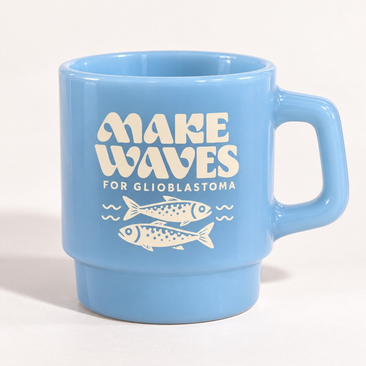 Powder blue milk glass cup with ivory Make Waves logo and sardines